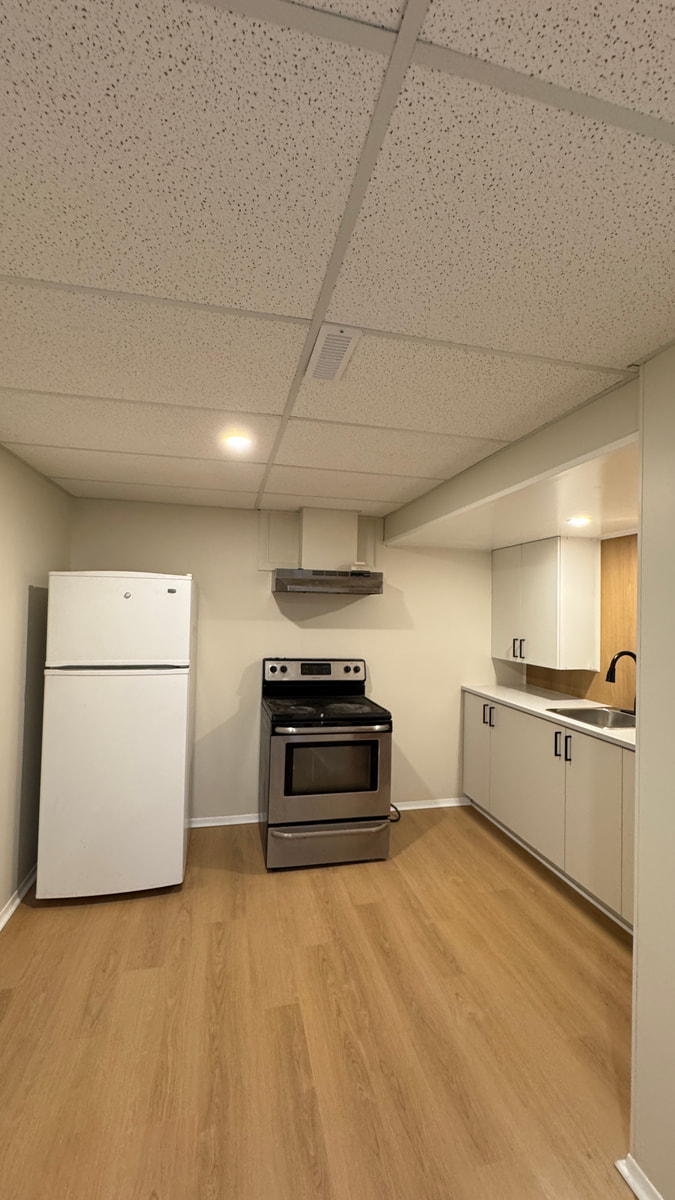 Kitchen after new cabinets and laminate flooring, Saskatoon