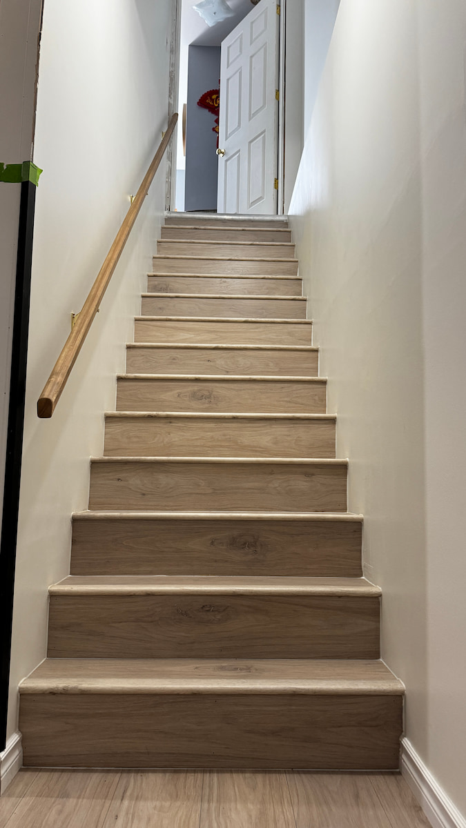 Staircase after laminate flooring and stair nosing, Saskatoon